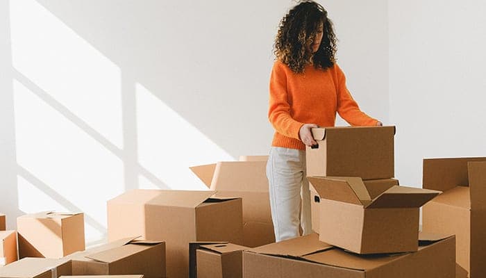 lady packing boxes